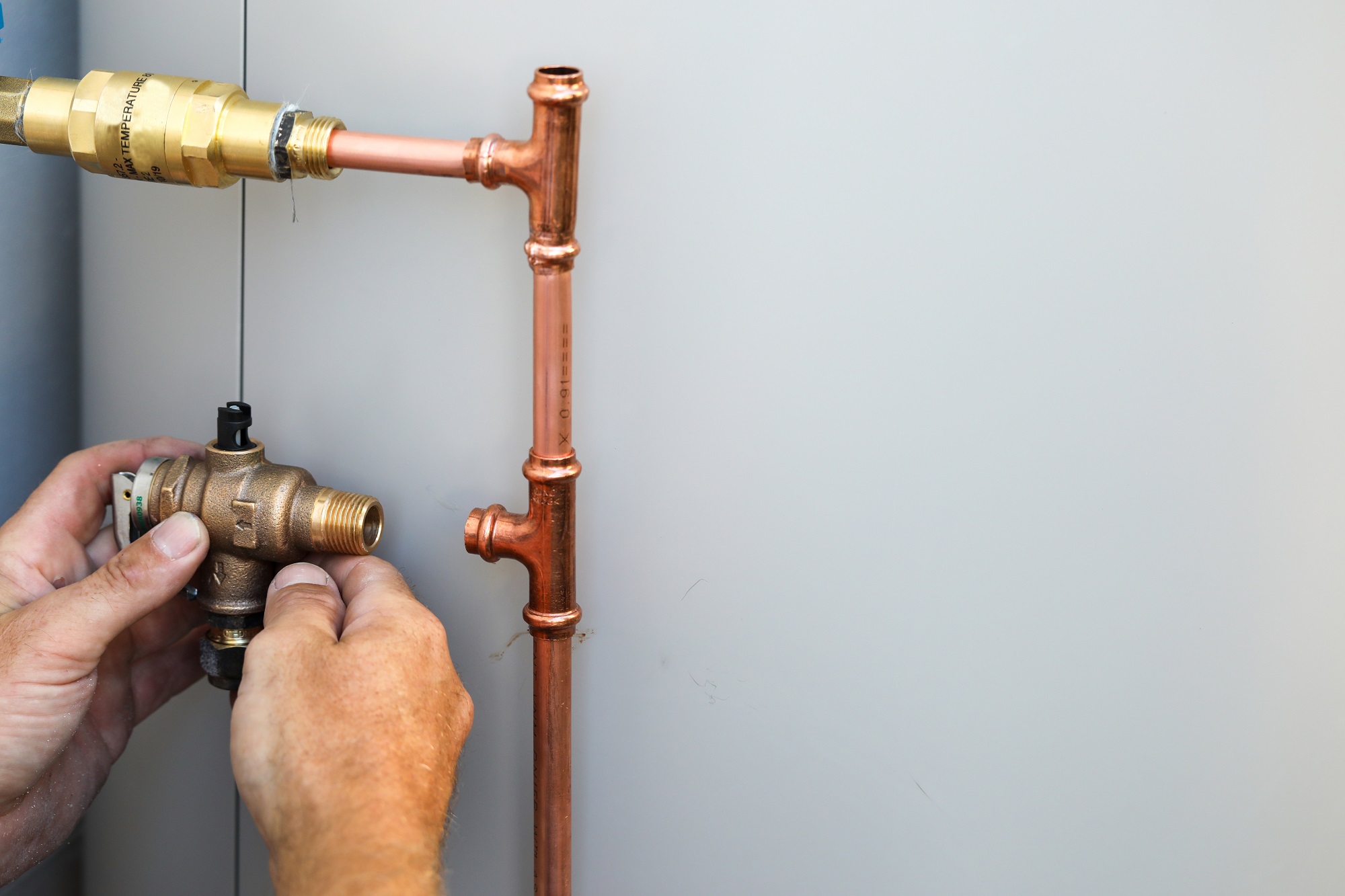 A close up of a plumber installing gas pipes do you have a gas fitting emergency in noosa